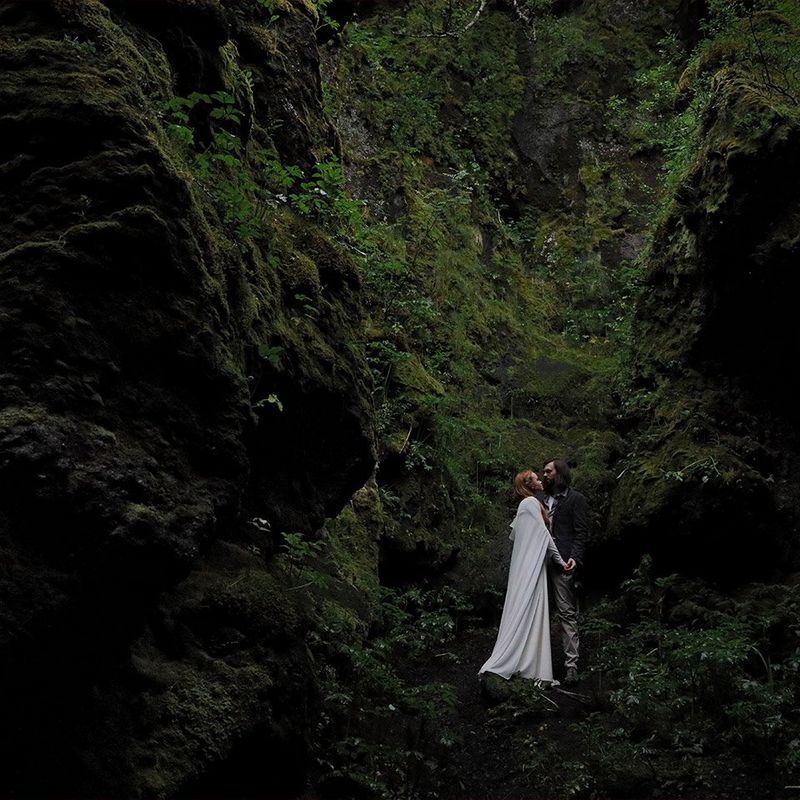 Eloped couple on green mountain side in Iceland shot on the Canon EOS R and RF 24-105mm F4L IS USM