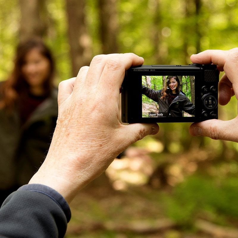 The Canon PowerShot SX740 HS photographing a girl in the woods